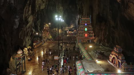 Pilgrims-and-Tourists-Crowd-inside-Hindu-Temple-of-Batu-Caves,-High-Panorama-View