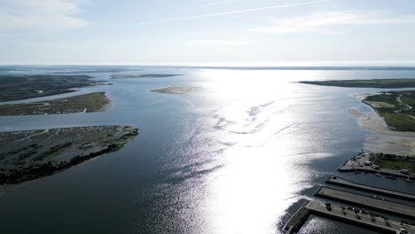 Expansive-aerial-view-of-Cais-do-Bico,-shimmering-waters-in-Murtosa,-Aveiro,-Portugal