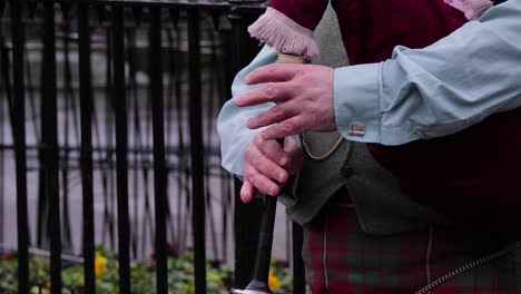 Close-detailed-shot-of-bagpipes-being-played-by-street-performer,-Edinburgh,-Scotland