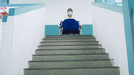 long-shot-of-an-elderly-woman-in-a-wheelchair-thoughtfully-looking-at-the-stands