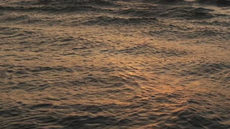 Small-waves-reflecting-the-golden-setting-sun