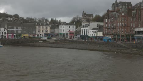 Slow-panning-shot-of-Obans-highstreet-with-Mccaigs-tower-behind