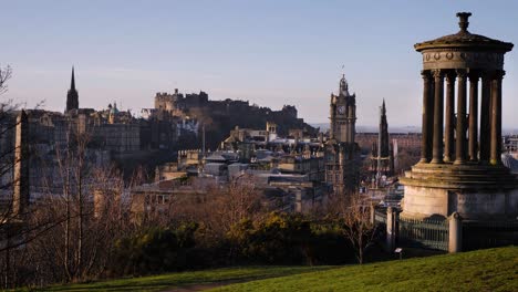 Medium-view-of-Edinburgh-skyline-and-Dugald-Stewart-Monument-from-Calton-Hill,-Edinburgh,-Scotland