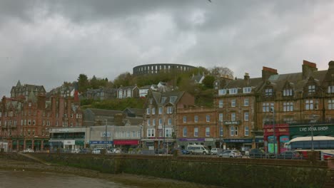 Hand-held-shot-of-the-historic-remains-of-the-Mccaigs-tower-overtowering-Oban