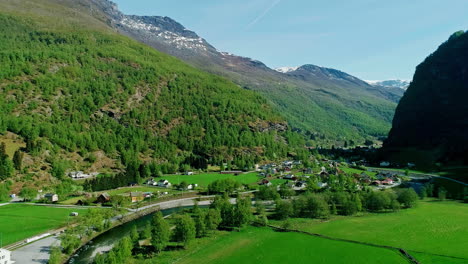 Drone-aerial-view-of-an-idyllic-town-in-the-middle-of-a-green-valley