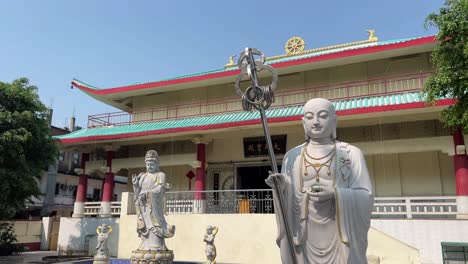 Statues-of-monk-present-outside-a-monastery-in-Gaya,-India-during-summer-afternoon