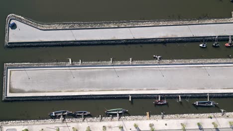 Top-down-view-of-the-geometric-Cais-do-Bico-boat-deck-in-Murtosa,-Aveiro,-Portugal