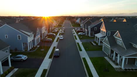 Golden-hour-sunset-in-new-neighborhood-with-modern,-uniform-houses