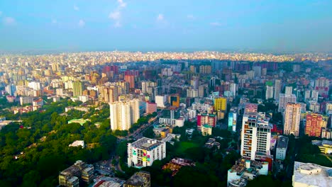 Aerial-backward-megacity-Dhaka-in-Bangladesh,-poor-third-world-country-in-half-sunlight-and-half-cloud-shadow