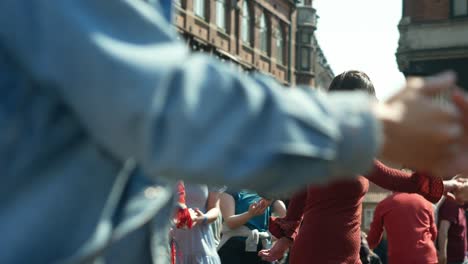 People-dancing-on-square-Kultorvet-in-Copenhagen-on-sunny-day