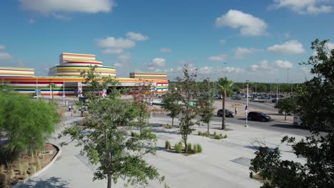 Drone-advancing-near-trees-in-the-Cultural-Park-of-Reynosa,-Mexico