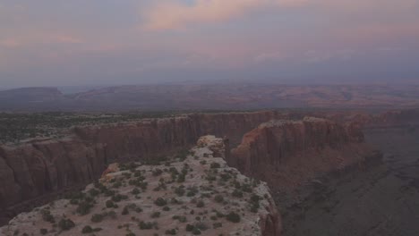 Aerial-scene-during-sunset-above-the-vast-canyons-of-the-Moab-desert-during-sunset