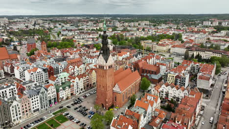 Aerial-orbiting-shot-of-church-in-polish-Town-of-Elblag-in-old-town