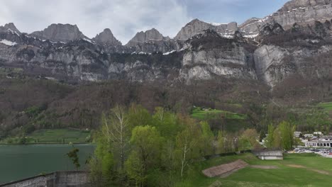 Springtime-at-Walensee-with-the-Churfirsten-range,-Switzerland---aerial