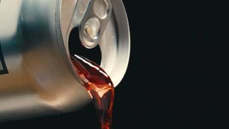 Red-wine-or-soda-liquid-pouring-out-of-silver-can-in-super-slow-motion,-black-background-of-canned-drink-at-4k-800fps