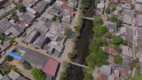 Tilt-shot-from-a-drone-of-a-poor-neighborhood-in-Cartagena,-Colombia