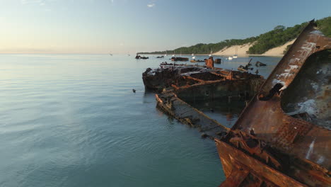Aerial-Closeup-Fly-Shipwreck-Rusted-Vehicle-Sank-in-Tangalooma-Wrecks-Sea-Coast-travel-destination-in-Moreton-Island