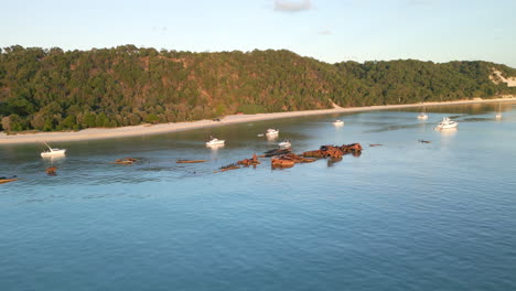 Moreton-Island-Beach-Coast,-Tangalooma-Shipwreck-Aerial-Drone-View,-White-Sand-beach-with-green-cliffs