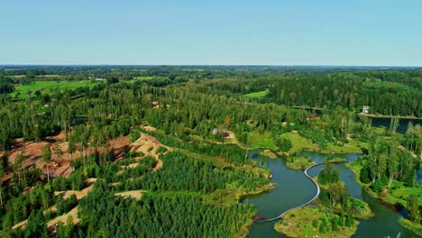 Aerial-tracking-shot-of-nature-in-Kemeri-National-Park,-summer-in-sunny-Latvia