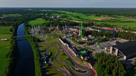 Aerial-view-around-the-Powerpark-theme-park,-summer-evening-in-Harma,-Finland