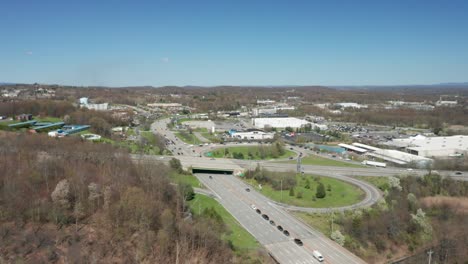 4K-Aerial-Drone-footage-of-industrial-shopping-centers-and-strip-malls-in-Middletown-New-York-and-traffics-can-be-seen-with-mountains-in-the-background