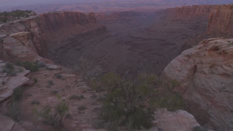 Aerial-scene-above-the-vast-rock-formations-of-the-Moab-desert-during-sunset---Utah