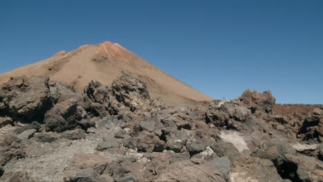 Pico-del-Teide-volcano-behind-rocks-on-Tenerife,-Canary-Islands-in-spring