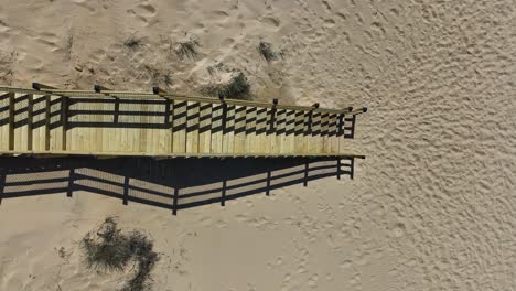 Direct-aerial-of-a-staircase-attached-to-the-boardwalk