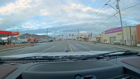 POV---Driving-on-Main-street-to-pull-into-McDonald's-fast-food-drive-thru-at-a-truck-stop-along-Interstate-10-in-the-Southwest
