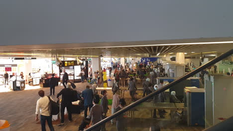 Busy-Zurich-airport-security-check-in-slow-motion-with-people-rushing-to-flights