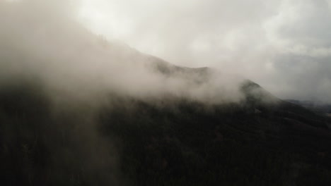 Aerial-View-Of-Misty-Cloudy-Mountainous-Dark-Forest,-Olympic-Peninsula,-Washington-USA