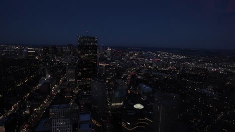 Boston-skyline-during-the-evening-hours-from-the-top-of-a-sky-scraper-viewing-deck-in-4k