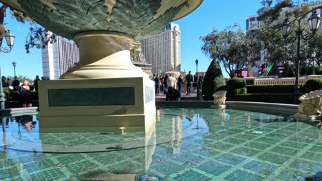 Las-Vegas-USA-on-Sunny-Day,-Small-Bellagio-Fountain-and-People-on-Viewpoint-Above-Strip