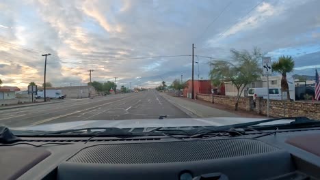 POV---Driving-on-Central-Boulevard-out-of-the-north-end-of-Quartzsite-past-small-businesses-and-campgrounds