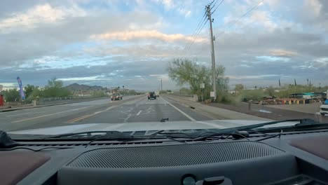 POV---Driving-on-Main-Street-past-businesses-and-campgrounds