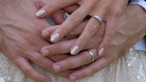 Slow-motion-revealing-shot-of-a-married-couples-hand-with-their-new-wedding-rings