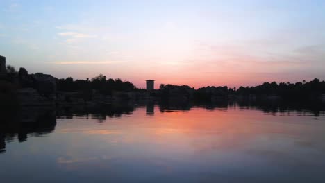 Aerial-of-the-Nile-River-,-traditional-Egyptian-sailing-boats,-in-Aswan,-Egypt,-embodying-the-concept-of-timeless-maritime-heritage-and-cultural-richness