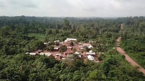 Central-Ghana,-Fly-over-Remote-village-surrounded-by-rain-forest-and-cocoa-farms