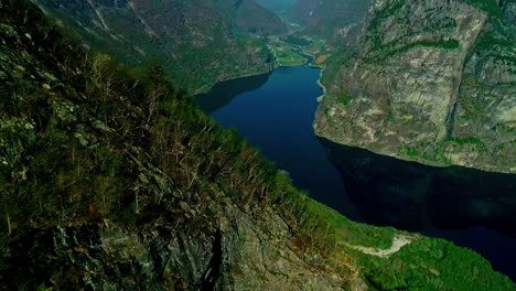 Stunning-View-Of-Fjords-Flow-Through-Towering-Mountainscape-In-Norway