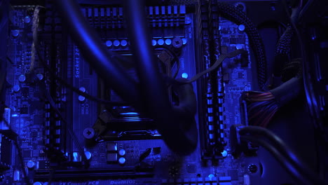 An-up-close-of-the-computer-motherboard,-in-dynamic-changing-hues,-symbolizes-the-forefront-of-innovation-and-connectivity-in-the-digital-age