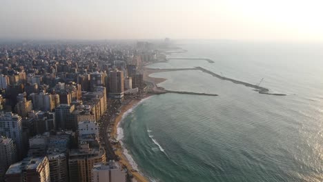 Aerial-view-showcases-the-coastal-residential-district-of-Alexandria,-a-Mediterranean-port-city-in-Egypt,-embodying-the-concept-of-seaside-living-and-maritime-charm