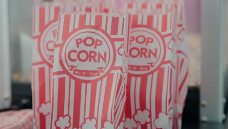 Classic-red-and-white-striped-popcorn-bags-ready-for-a-movie-night