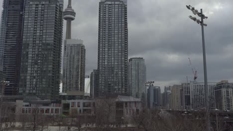 Downtown-Toronto-Skyline-And-Gardner-Expressway,-Sliding-Shot