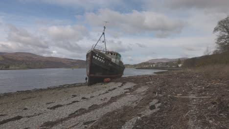 Slow-panning-shot-of-a-photographer-capturing-the-historic-Corpach-Shipwreck