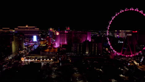 Las-Vegas,-Ee.uu.,-Vista-Aérea-De-Edificios-Brillantes-Y-Noche,-Noria-De-Grandes-Apostadores,-El-Linq,-Flamenco,-Bellagio