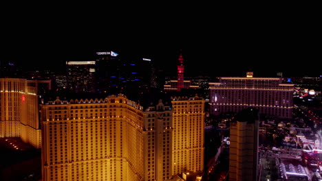 Las-Vegas-USA,-Aerial-View-of-Strip-Casinos-and-Hotels-at-Night,-Paris-Eiffel-Tower,-Bellagio,-Cosmopolitan