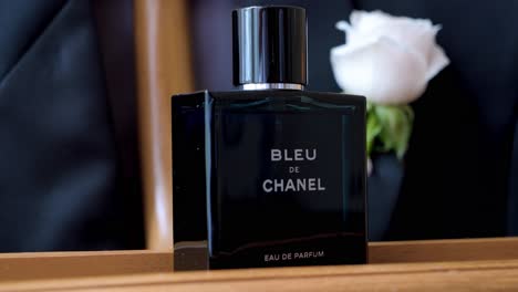 Close-up-captures-elegance-of-perfume-bottle-with-its-sleek-design-and-iconic-blue-hue