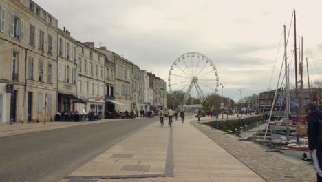 The-road-near-the-marina-of-La-Rochelle-with-a-ferris-wheel-in-the-distance