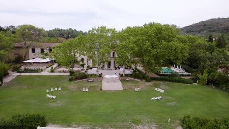 Aerial-shot-of-a-serene-wedding-venue-in-the-lush-countryside-of-Montpellier,-France