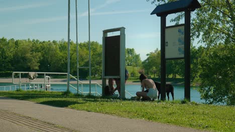 Casual-summer-day-by-Jarun-Lake,-Zagreb,-with-locals-enjoying-the-outdoors